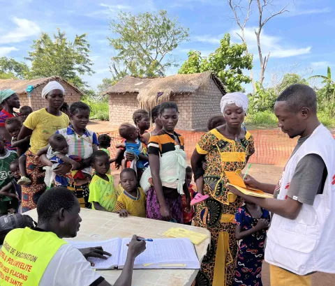 Mothers wait patiently with their children at a vaccination site in Mala, where MSF supports the Ministry of Health to strengthen routine immunization services.